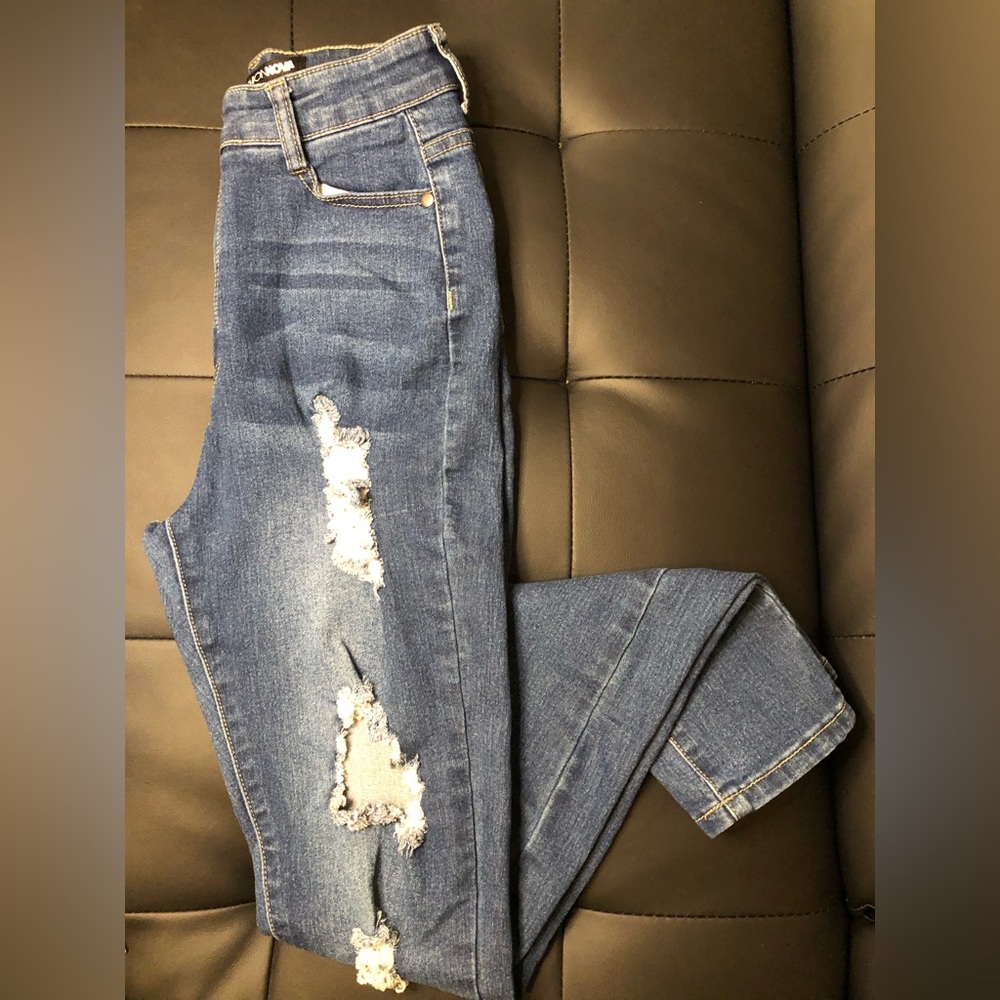 High waisted Fashion Nova jeans with rips on the front